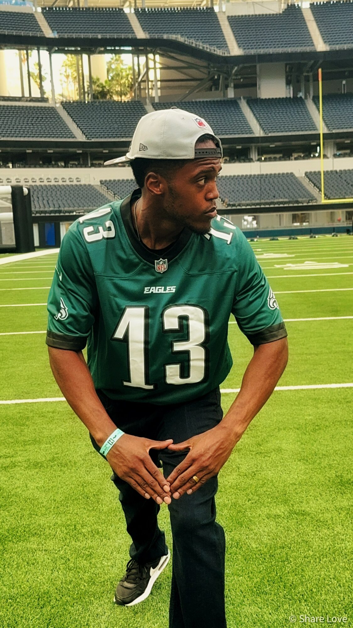 Tash Jordan in a football jersey on the field