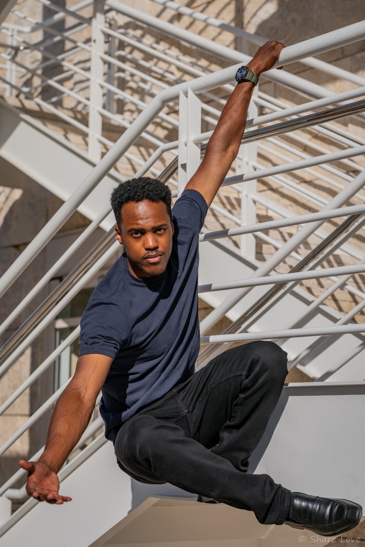 Tash Jordan mid-vault over a steel staircase railing