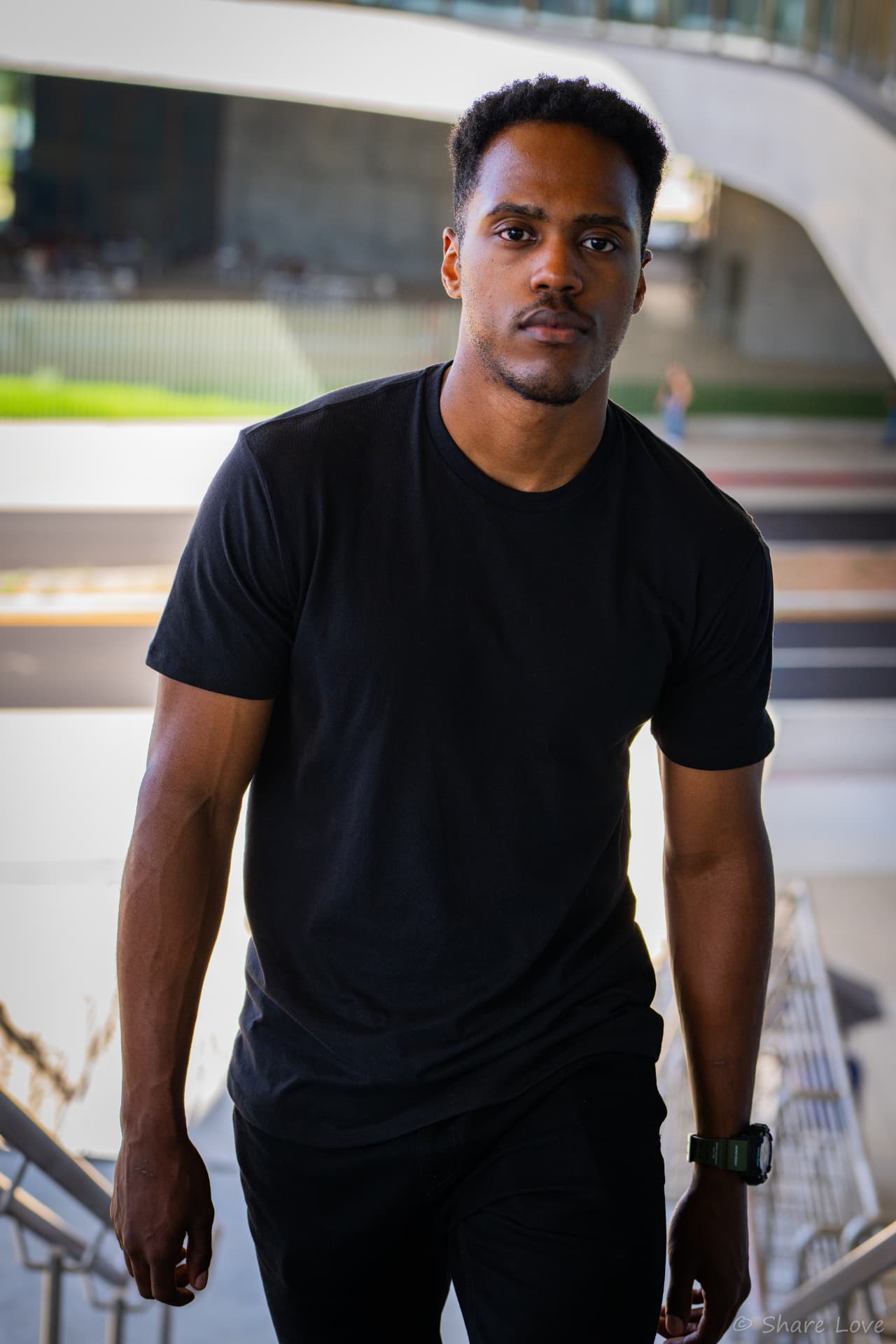 Tash Jordan walking down outdoor stairs toward the camera